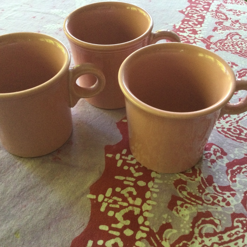 Pink fiesta ware mugs, three